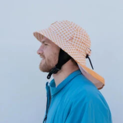 Plow Surf Co. | Orange Gingham | Plow Surf Hat | Surfing Hat | Beach + Water Activity Headwear | -Surf Board Pro Store Buy Plow Surf Co Orange Gingham Surfing Hat With Chin Strap Side 39565.1692946129
